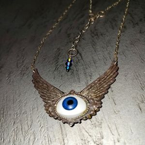 Silver wing eye necklace
